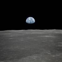 AS11-44-6552 (16-24 July 1969) --- This view of Earth rising over the moon's horizon was taken from the Apollo spacecraft. The lunar terrain pictured is in the area of Smyth's Sea on the nearside. Coordinates of the center of the terrain are 85 degrees east longitude and 3 degrees north latitude. While astronaut Neil A. Armstrong, commander; and Edwin E. Aldrin Jr., lunar module pilot, descended in the Lunar Module (LM) "Eagle" to explore the Sea of Tranquility region of the moon, astronaut Michael Collins remained with the Command and Service Modules (CSM) "Columbia" in lunar orbit.